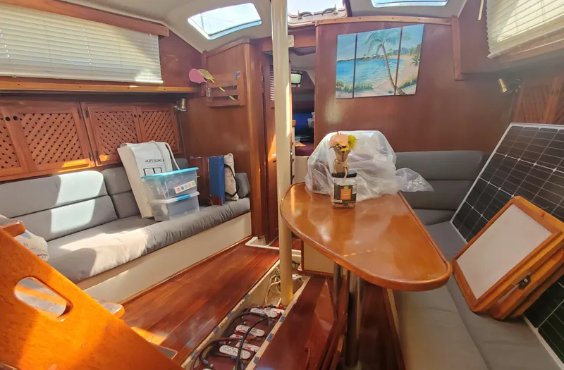 Slide: The Image of Interior of 1987 Irwin MKII sailboat with cozy seating and wooden finishes. - 22