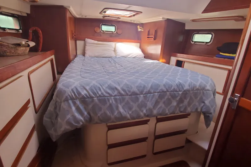 Slide: The Image of Cozy cabin interior of 1987 Irwin MKII sailboat with bed and storage. - 23