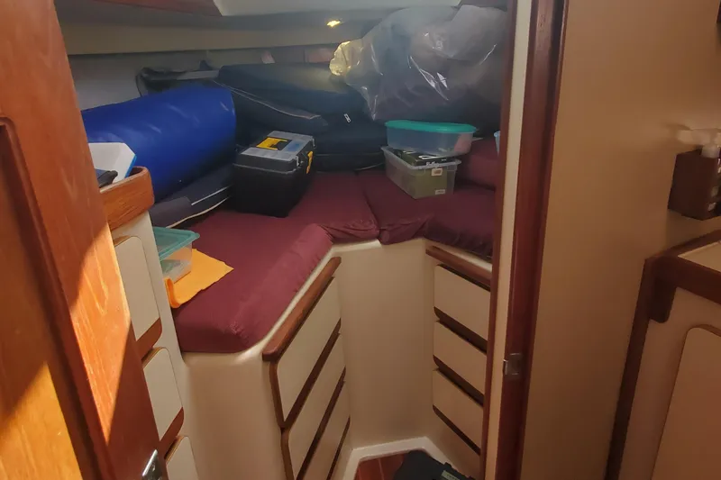 Slide: The Image of 1987 Irwin MKII cabin interior with storage and cushions. - 26