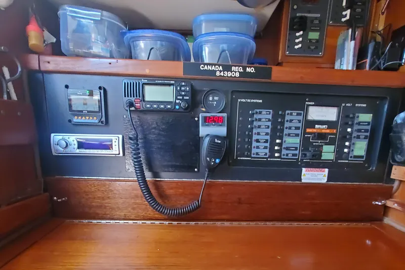 Slide: The Image of Control panel of 1987 Irwin MKII sailboat with communication and navigation equipment. - 28
