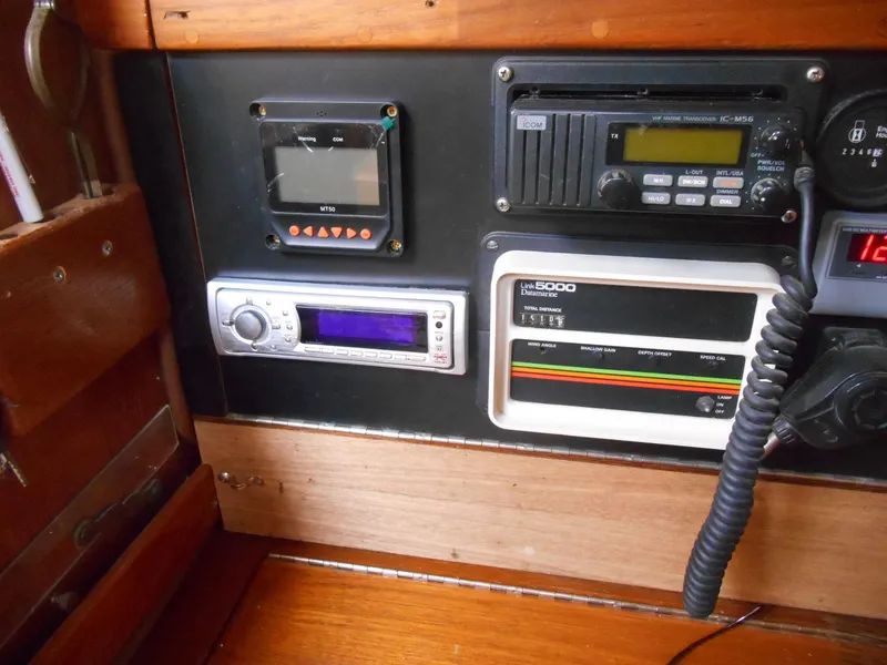 Slide: The Image of Control panel of a 1987 Irwin MKII sailboat with navigation and communication equipment. - 29