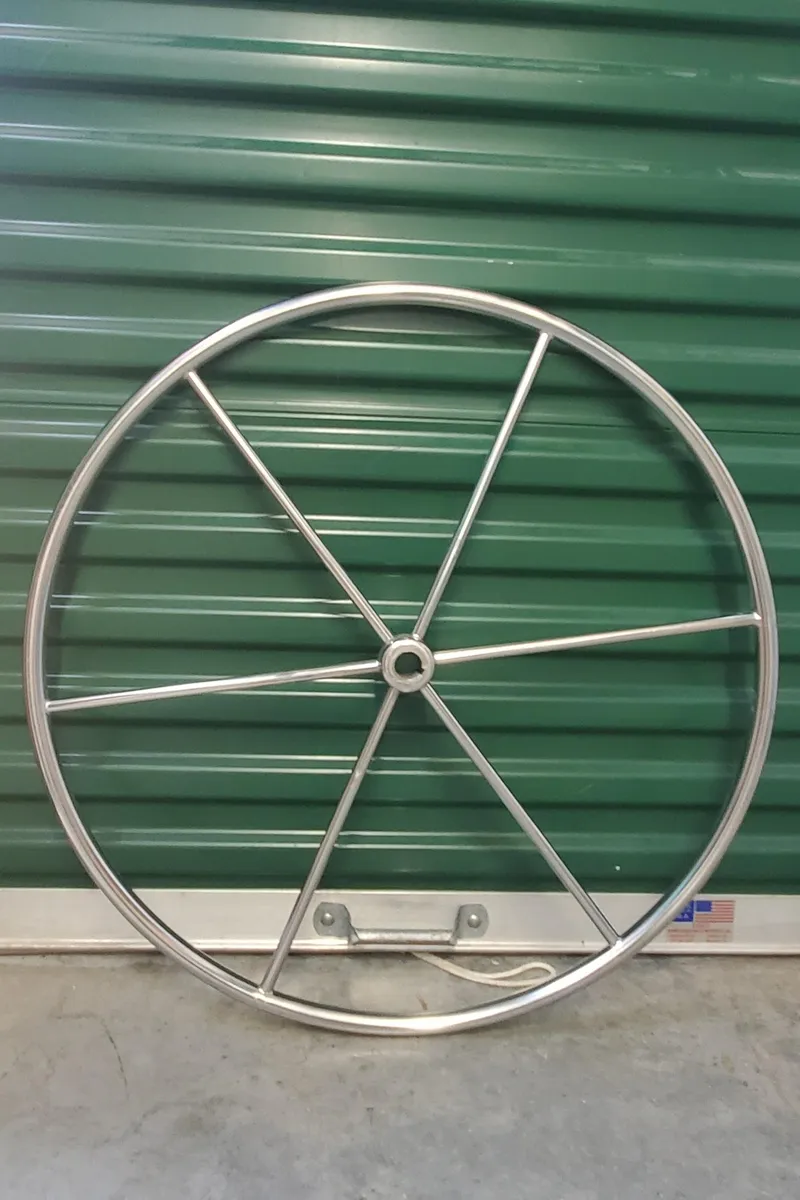 Slide: The Image of Stainless steel wheel with spokes, Irwin MKII 1987, against green background. - 38