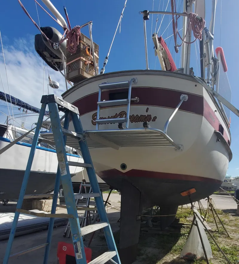 Slide: The Image of 1987 Irwin MKII sailboat on dry dock with ladder and clear sky. - 4