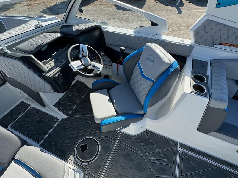 Slide: The Image of 2025 Tigé 24RZX boat interior with modern steering and seating design. - 13