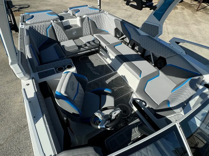 Slide: The Image of 2025 Tigé 24RZX boat interior with modern seating and sleek design. - 9