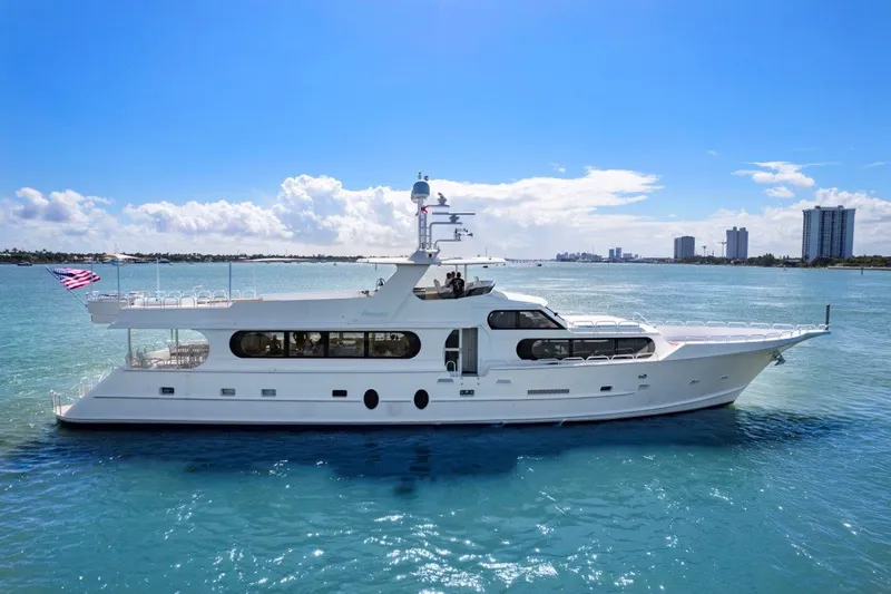 The Image of 1984 Broward 110 Motor Yacht cruising on clear blue water. - 0