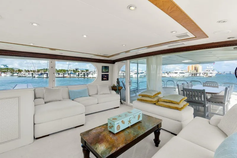 Slide: The Image of Luxurious interior of 1984 Broward 110 Motor Yacht with waterfront view. - 11