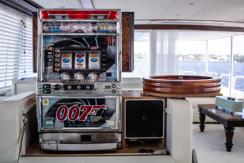 Slide: The Image of Slot machine on 1984 Broward 110 Motor Yacht interior. - 14
