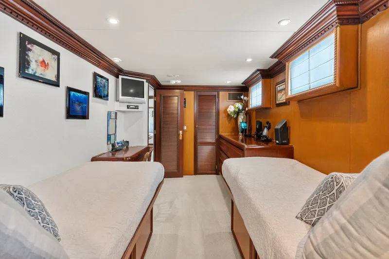 Slide: The Image of Luxurious twin cabin interior of 1984 Broward 110 Motor Yacht. - 40
