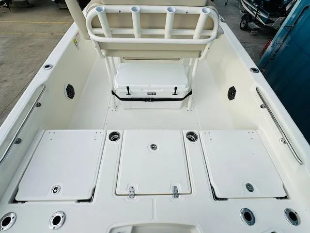 Slide: The Image of 2025 Boston Whaler 250 Dauntless boat deck with storage compartments and seating. - 11