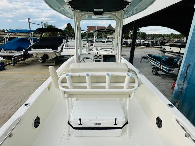 Slide: The Image of 2025 Boston Whaler 250 Dauntless boat interior at a marina. - 12