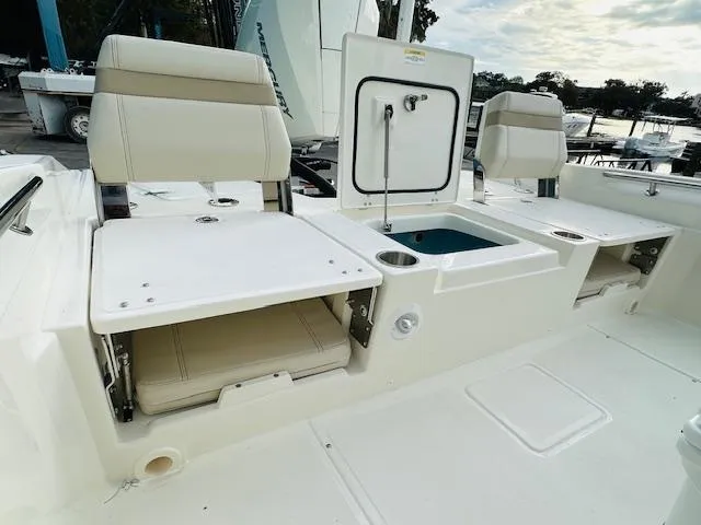 Slide: The Image of 2025 Boston Whaler 250 Dauntless boat interior with seating and storage compartments. - 15