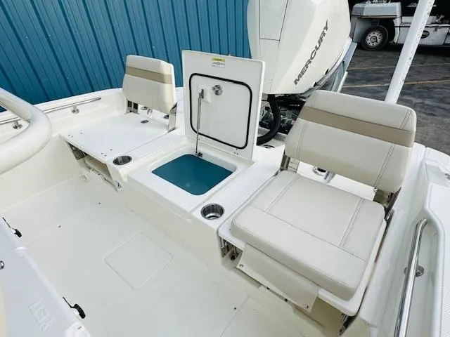 Slide: The Image of 2025 Boston Whaler 250 Dauntless boat interior with seating and storage compartments. - 17