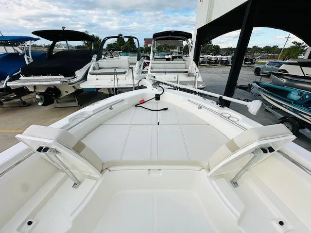 Slide: The Image of 2025 Boston Whaler 250 Dauntless boat interior, showcasing spacious seating and sleek design. - 25