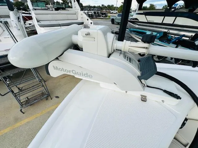 Slide: The Image of 2025 Boston Whaler 250 Dauntless with MotorGuide trolling motor, docked in marina. - 26