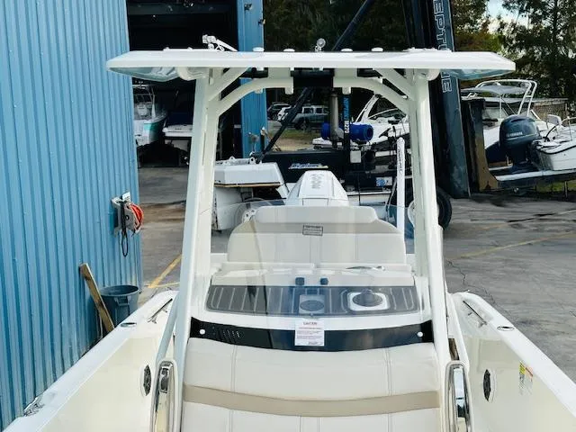 Slide: The Image of 2025 Boston Whaler 250 Dauntless boat docked at a marina. - 28
