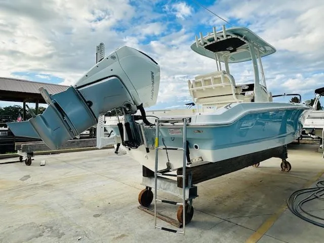 Slide: The Image of 2025 Boston Whaler 250 Dauntless boat with Mercury outboard engine on a trailer. - 6