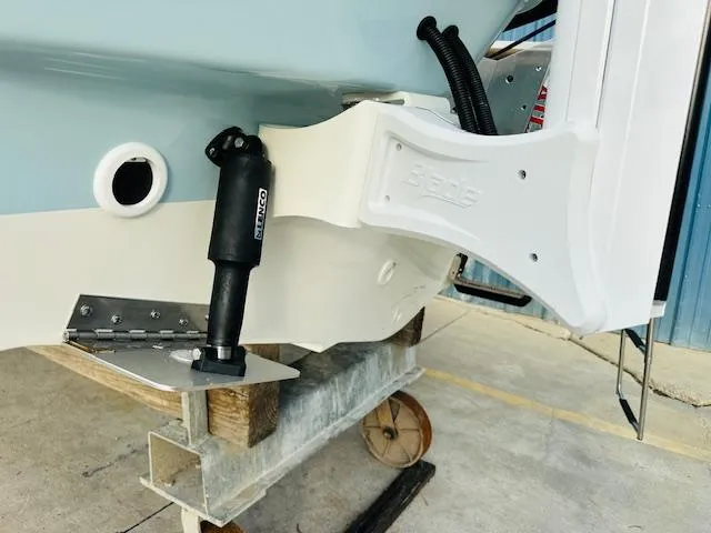 Slide: The Image of Close-up of 2025 Boston Whaler 250 Dauntless boat hull and trim tab. - 9