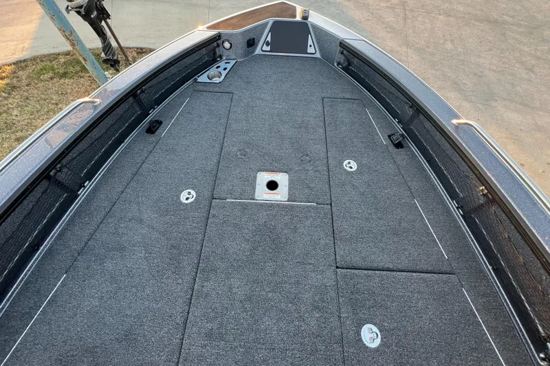 Slide: The Image of 2025 Lund 219 Pro-V GL boat deck with spacious storage compartments. - 13