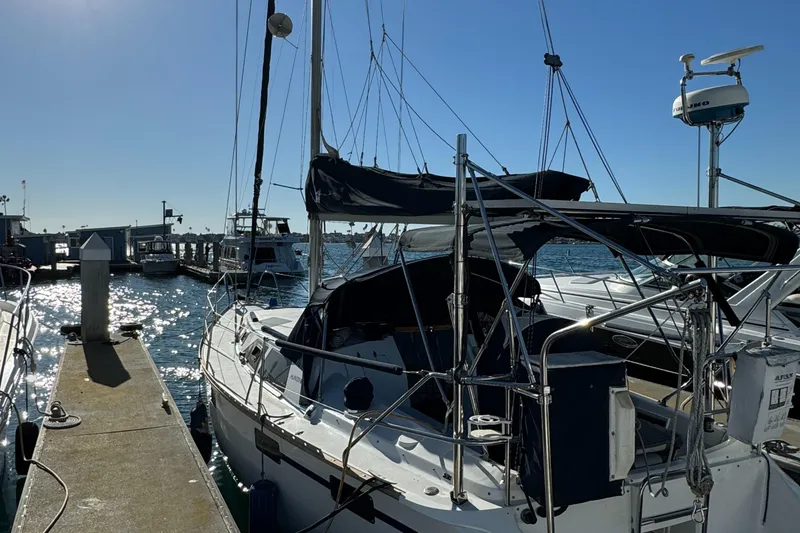 Slide: The Image of Sailboat docked at marina, 1992 Hunter 35 model, sunny day, calm waters. - 10