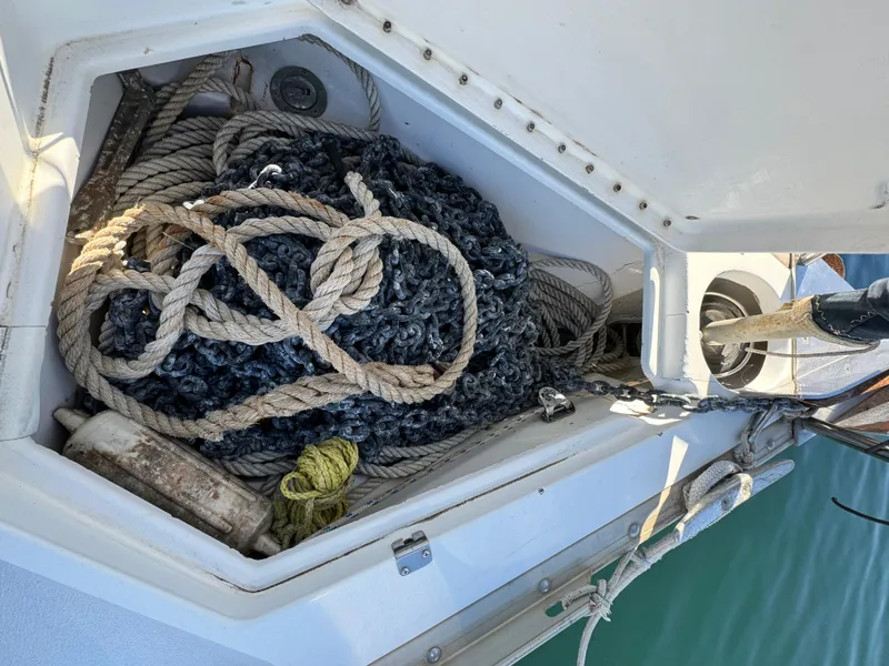 Slide: The Image of Anchor locker of 1992 Hunter 35 sailboat with ropes and equipment. - 13