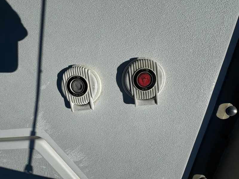 Slide: The Image of Two circular boat fittings on a 1992 Hunter 35 sailboat deck. - 14