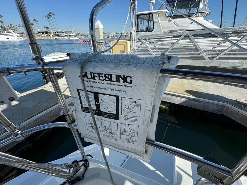 Slide: The Image of Lifesling rescue system on a 1992 Hunter 35 sailboat docked at a marina. - 20