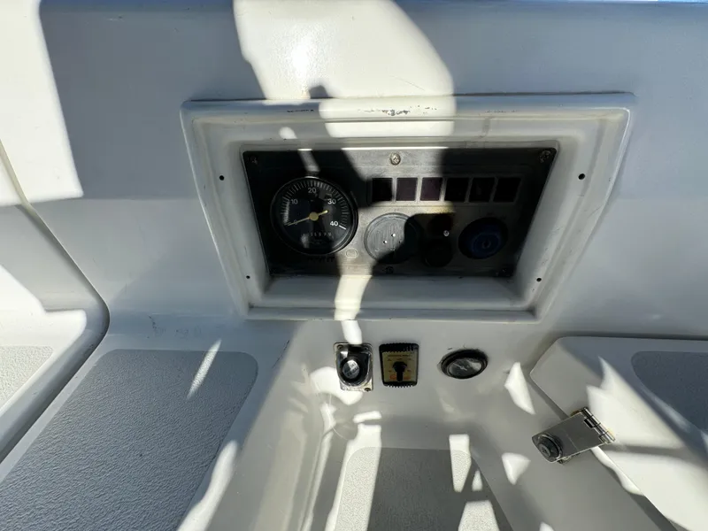 Slide: The Image of Control panel of a 1992 Hunter 35 boat with gauges and switches. - 23