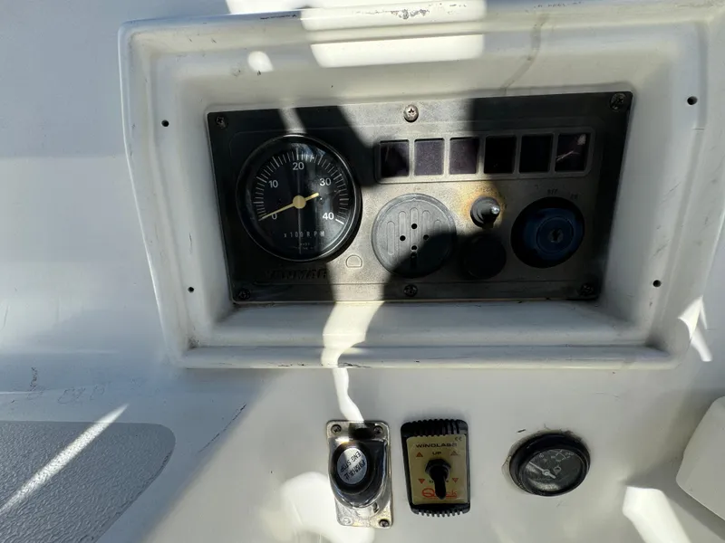 Slide: The Image of Control panel of a 1992 Hunter 35 boat with gauges and switches. - 24