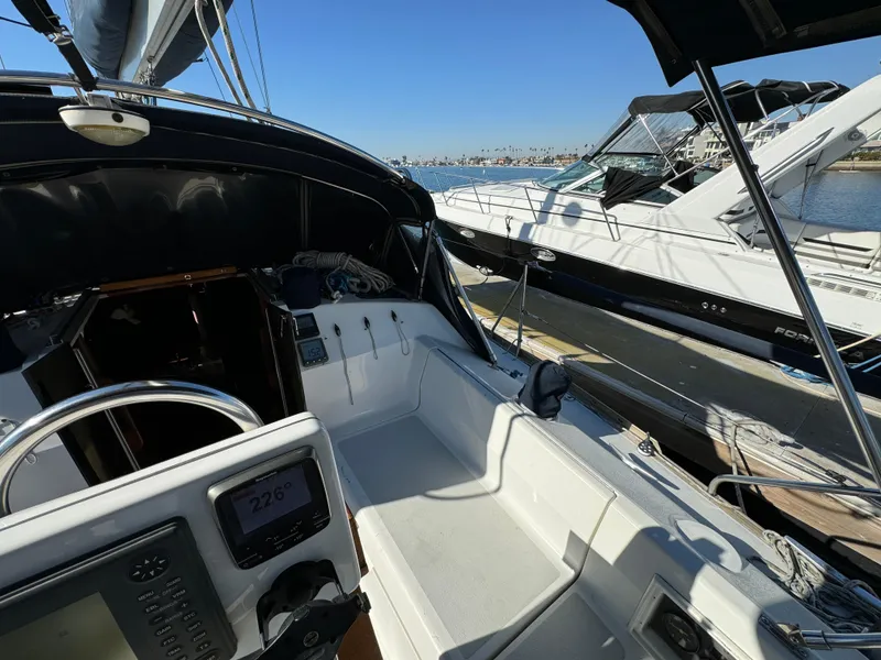 Slide: The Image of Cockpit view of a 1992 Hunter 35 sailboat docked at a marina. - 32