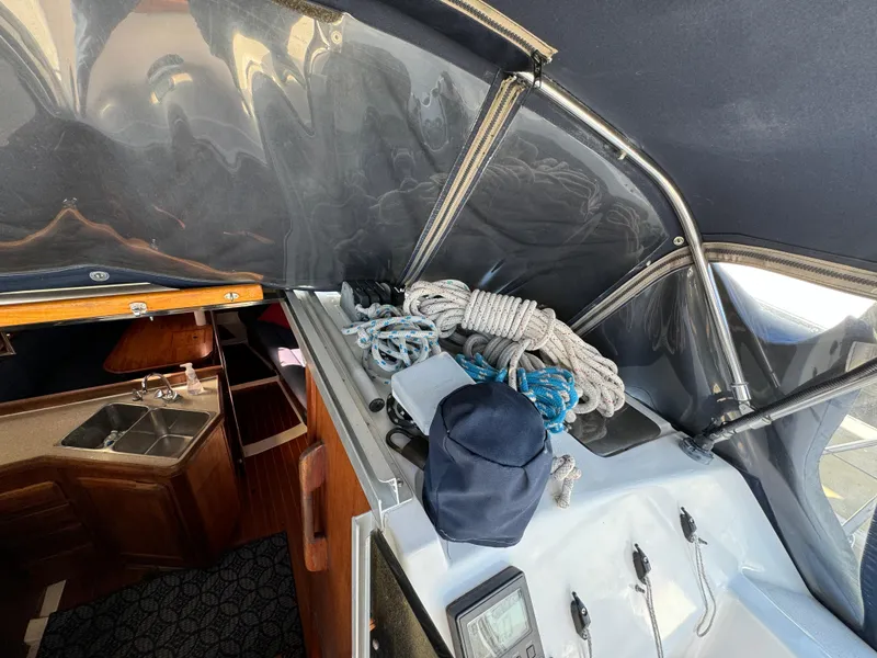 Slide: The Image of Interior view of a 1992 Hunter 35 sailboat with ropes and equipment. - 35