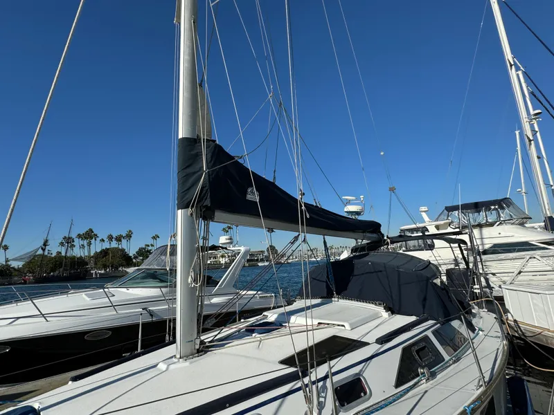 Slide: The Image of 1992 Hunter 35 sailboat docked in marina under clear blue sky. - 4