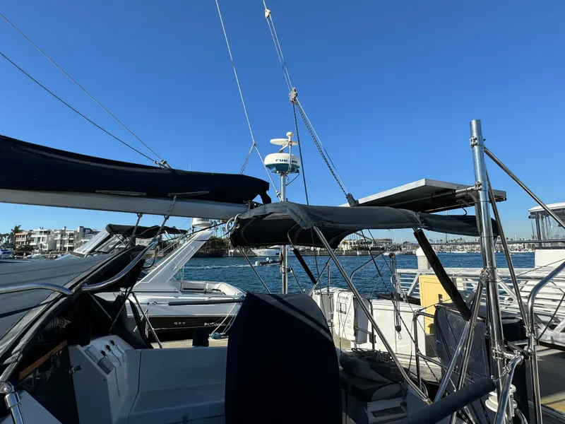 Slide: The Image of Sailboat Hunter 35, 1992 model, docked at marina under clear blue sky. - 8