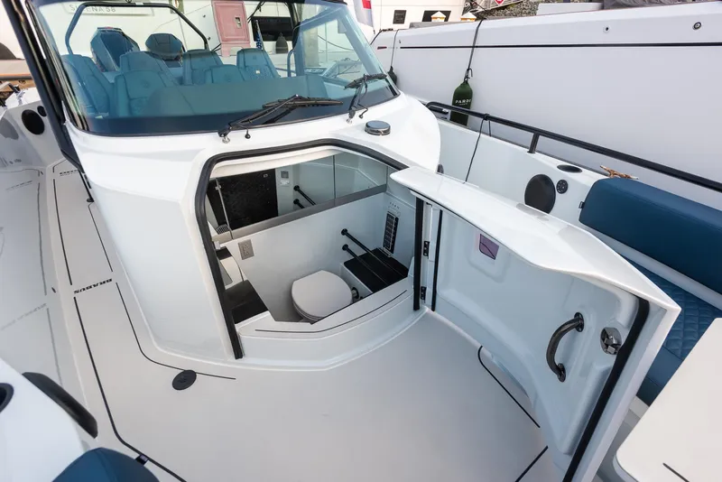 Slide: The Image of 2023 BRABUS Shadow 500 T-Top AFT Cabin interior with open cabin door and seating. - 10