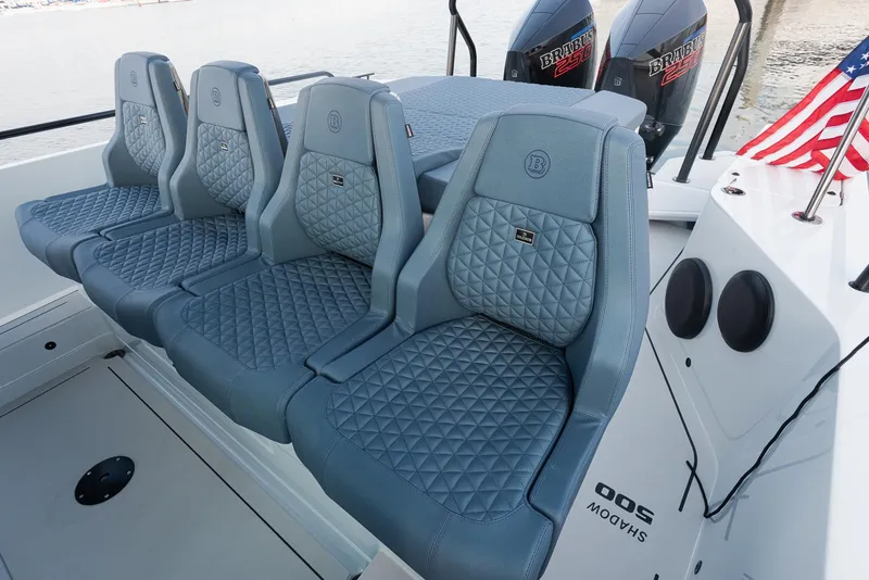 Slide: The Image of 2023 BRABUS Shadow 500 T-Top AFT Cabin with luxurious seating and dual engines. - 13