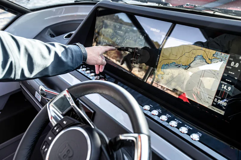 Slide: The Image of BRABUS Shadow 500 T-Top AFT Cabin 2023 dashboard with touchscreen navigation system. - 5