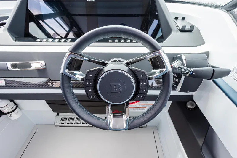 Slide: The Image of Steering wheel of 2023 BRABUS Shadow 500 T-Top AFT Cabin boat, sleek and modern design. - 7