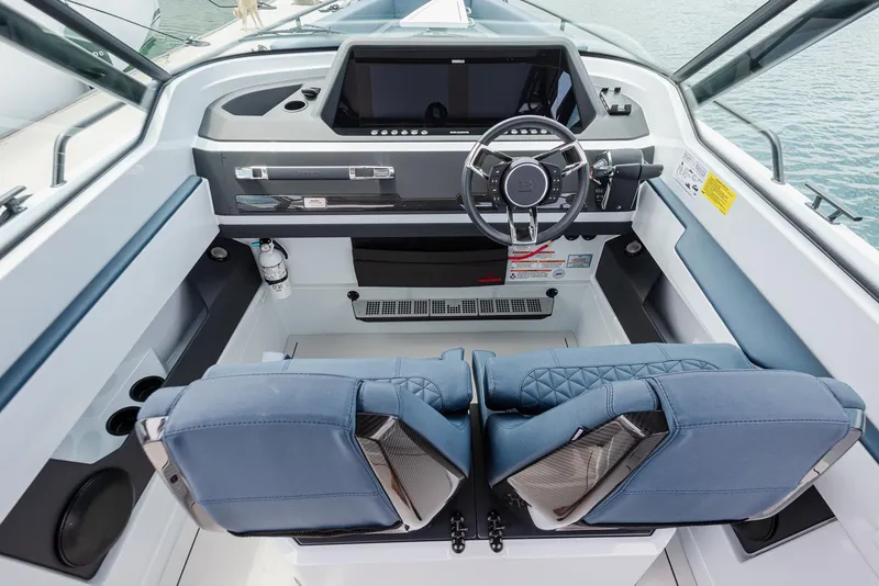 Slide: The Image of 2023 BRABUS Shadow 500 T-Top AFT Cabin cockpit with modern steering and controls. - 8