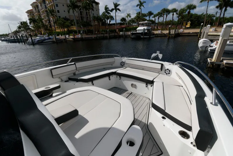 Slide: The Image of 2023 Jeanneau Leader 10.5 CC boat with spacious seating at marina. - 13