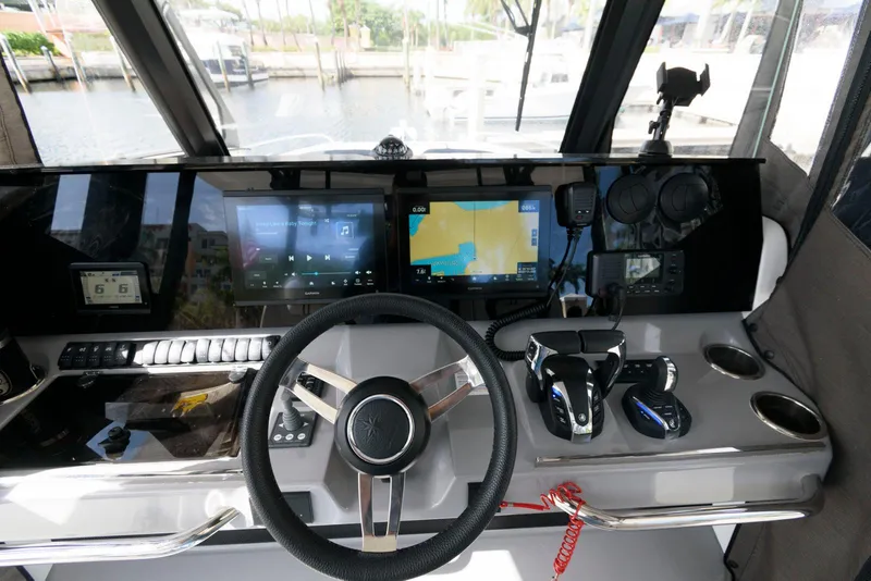 Slide: The Image of 2023 Jeanneau Leader 10.5 CC helm with advanced navigation and control systems. - 17