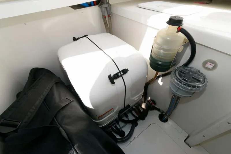 Slide: The Image of 2023 Jeanneau Leader 10.5 CC engine compartment with equipment and storage. - 30