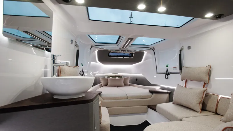 Slide: The Image of Luxurious interior of 2023 Axopar 37 Sun-Top Wet Bar with modern seating and skylights. - 4