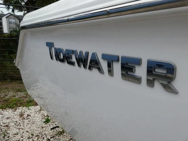 Slide: The Image of 2023 Tidewater 210 CC Adventure boat, side view with logo. - 4