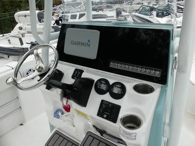 Slide: The Image of 2023 Tidewater 210 CC Adventure boat console with Garmin navigation system. - 7