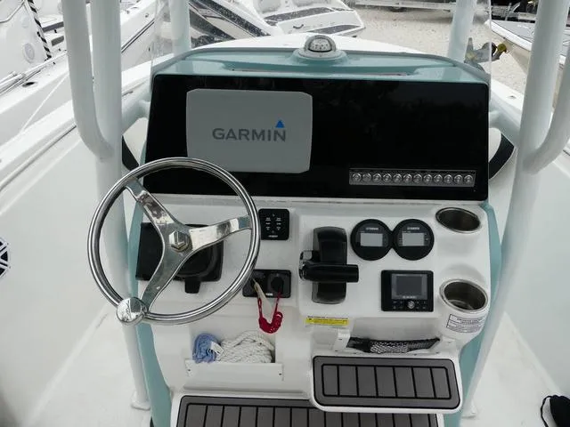 Slide: The Image of 2023 Tidewater 210 CC Adventure boat console with Garmin navigation system. - 8