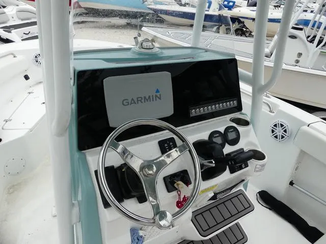 Slide: The Image of 2023 Tidewater 210 CC Adventure boat console with Garmin navigation system. - 9