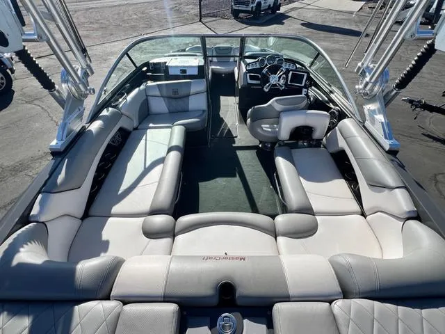 Slide: The Image of 2012 MasterCraft X25 boat interior with spacious seating and modern dashboard. - 10