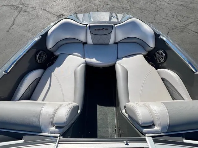 Slide: The Image of 2012 MasterCraft X25 boat interior with luxurious seating and sleek design. - 16