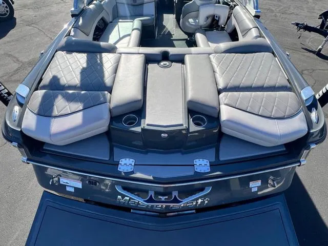 Slide: The Image of 2012 MasterCraft X25 boat with luxurious seating and sleek design. - 8
