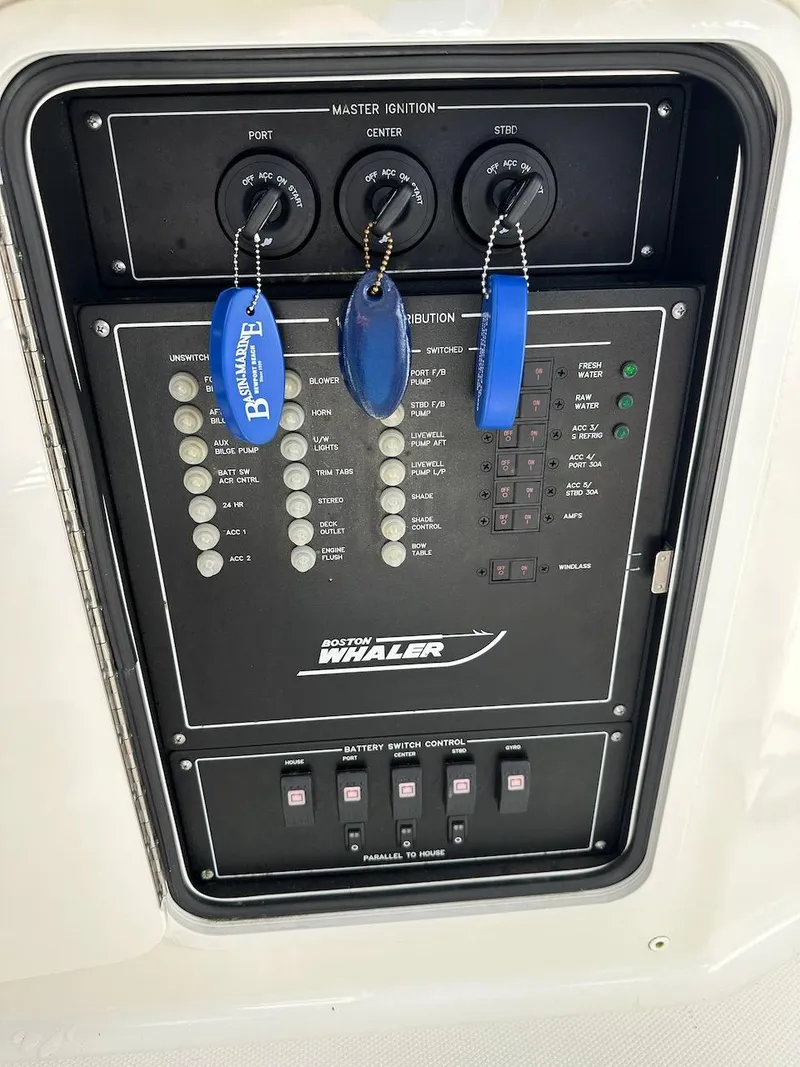 Slide: The Image of Control panel of a 2019 Boston Whaler 350 Realm boat with ignition keys. - 40
